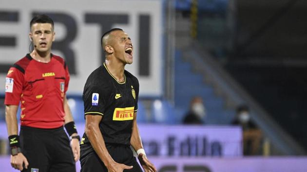 Inter Milan's Alexis Sanchez, right, reacts during the Serie A soccer match between Spal and Inter Milan, at the Paolo Mazza Stadium in Ferrara, Italy, Thursday, July 16, 2020. (AP) Inter Milan's Alexis Sanchez, right, reacts during the Serie A soccer match between Spal and Inter Milan, at the Paolo Mazza Stadium in Ferrara, Italy, Thursday, July 16, 2020. (AP)