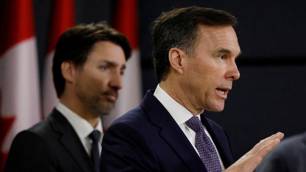 Canada's Minister of Finance Bill Morneau attends a news conference with Prime Minister Justin Trudeau in Ottawa, Ontario.(REUTERS)