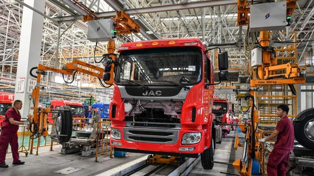 Employees work on a truck assembly line at a factory in Fuyang in China’s eastern Anhui province on July 16. Manufacturing and some other industries are almost back to normal operating levels. But consumer spending is weak due to public unease about possible job losses. (AFP) Employees work on a truck assembly line at a factory in Fuyang in China’s eastern Anhui province on July 16. Manufacturing and some other industries are almost back to normal operating levels. But consumer spending is weak due to public unease about possible job losses. (AFP)