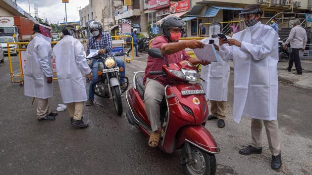 Police screen commuters during reinforced lockdown due to surge in COVID-19 cases in Bengaluru on July 16. In the last week, India has added an average of 30,076 cases a day, up from 23,895 a day in the seven-day period before that. Several states have opted to bring back regional or complete lockdowns of late including Karnataka, Bihar and Assam. (Shailendra Bhojak / PTI) Police screen commuters during reinforced lockdown due to surge in COVID-19 cases in Bengaluru on July 16. In the last week, India has added an average of 30,076 cases a day, up from 23,895 a day in the seven-day period before that. Several states have opted to bring back regional or complete lockdowns of late including Karnataka, Bihar and Assam. (Shailendra Bhojak / PTI)