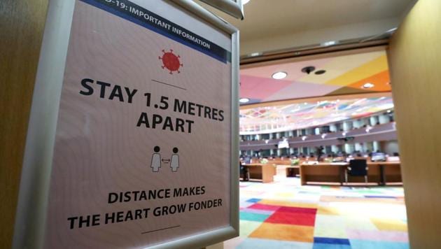 A sign informing about social distancing is seen at the entrance of the meeting room where an EU leaders summit will take place, especially adapted to keep the social distancing amid the coronavirus disease (COVID-19) outbreak, at the European Council headquarters in Brussels, Belgium July 16, 2020.(REUTERS)