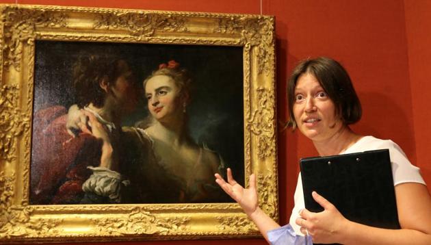 Kateryna Chuyeva, Director General of the Bohdan and Varvara Khanenko National Museum of Arts speaks next to the painting "An Amorous Couple" by Pierre Louis Goudreaux at the museum in Kyiv, Ukraine July 14, 2020. The artwork was stolen from the museum during the WWII, then discovered in the U.S. and returned to Ukraine earlier this year. (REUTERS)