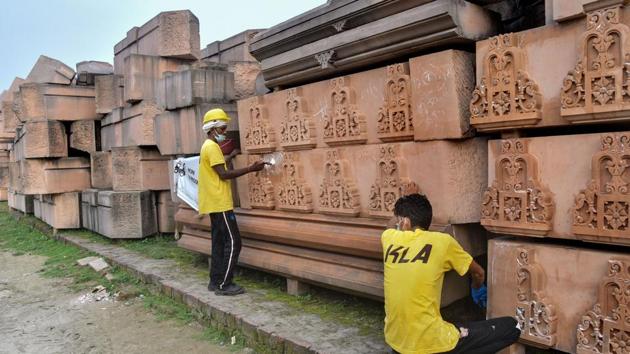 Workers clean the stones at Ram Janmabhoomi Nyas Karyashala in Ayodhya.(PTI)