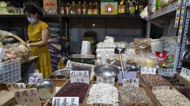 Various types of beans and pulses are displayed at a stall in Sanyuanli market in Beijing on July 15. “The national economy shifted from slowing down to rising in the first half of 2020,” the National Bureau of Statistics said in a statement, AP reported. (Giulia Marchi / Bloomberg) Various types of beans and pulses are displayed at a stall in Sanyuanli market in Beijing on July 15. “The national economy shifted from slowing down to rising in the first half of 2020,” the National Bureau of Statistics said in a statement, AP reported. (Giulia Marchi / Bloomberg)