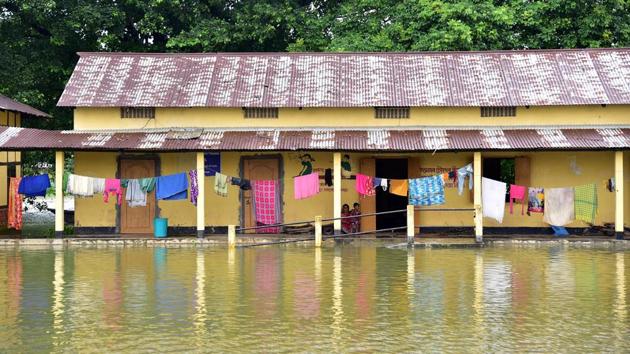 Clothes are hanged to dry in Jamlai High School flood relief camp in Kamrup district on July 17. According to an ASDMA bulletin on July 17, authorities are running relief camps and distribution centres across affected districts and over 51,000 uprooted are taking shelter in relief camps, HT reported. (ANI)