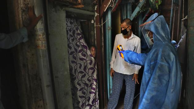 A doctor checks the temperature of a girl in Dharavi, one of Asia's largest slums, during Maharashtra government’s Covid-19 drive on Monday.(AP File Photo) A doctor checks the temperature of a girl in Dharavi, one of Asia's largest slums, during Maharashtra government’s Covid-19 drive on Monday.(AP File Photo)