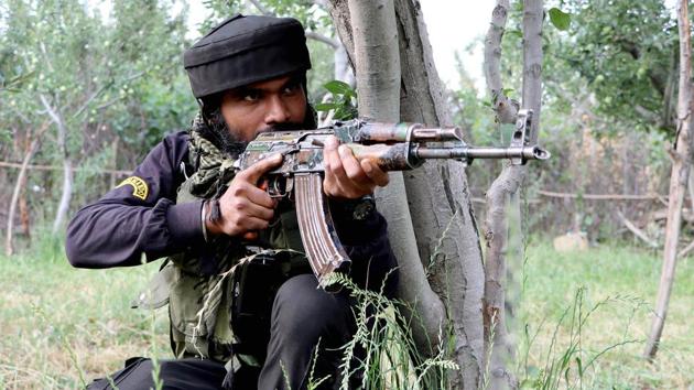 An Army trooper during the encounter in Amshipora village of in Kashmir’s Shopian district on Saturday.(ANI)