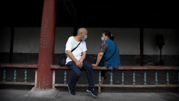 People wearing face masks interact with each other at the Temple of Heaven in Beijing, China on July 18. The first case of Covid-19 infection was reported in China in early January this year and it took three months to reach 1 million cases. It took the disease just four days to climb to 14 million cases from the 13 million recorded on July 13. (Mark Schiefelbein / AP) People wearing face masks interact with each other at the Temple of Heaven in Beijing, China on July 18. The first case of Covid-19 infection was reported in China in early January this year and it took three months to reach 1 million cases. It took the disease just four days to climb to 14 million cases from the 13 million recorded on July 13. (Mark Schiefelbein / AP)
