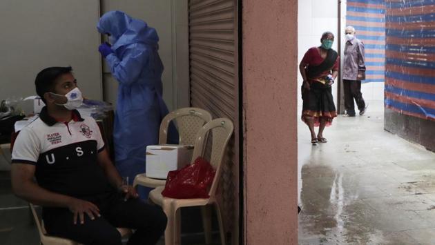Residents arrive for getting themselves tested for COVID-19 symptoms in Mumbai on July. With the pandemic considered to be plateauing in Mumbai, districts such as Thane, Raigad, Pune and Nanded are now major contributors to the spread of Covid-19 in the state. (Rajanish Kakade / AP)