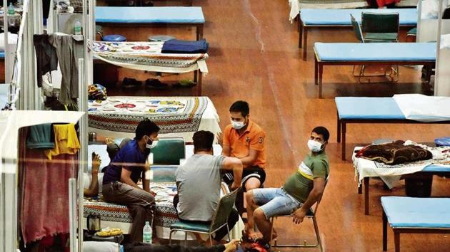 Patients at the CWG Village Covid Care Centre. (Mohd Zakir/HT photo)