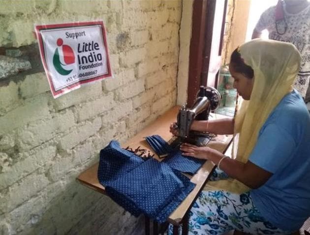 Women in some slum areas of Delhi are earning a livelihood by stitching masks with the help of an NGO.