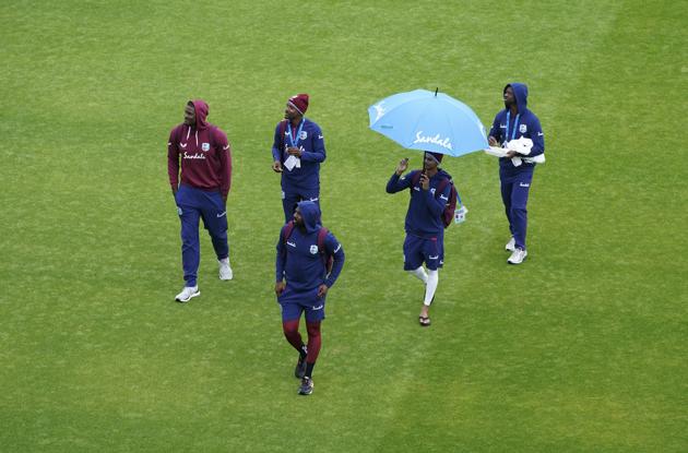 West Indies' captain Jason Holder, left, and teammates leave after the play is abandoned on the third day of the second cricket Test match between England and West Indies at Old Trafford in Manchester, England, Saturday, July 18, 2020. (AP Photo/Jon Super, Pool) (AP)