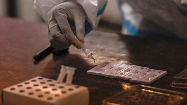 A health worker with COVID-19 test kits in New Delhi on July 17. “The number suggests that around 20,000 people were quickly tested positive with much less efforts in a period of around four weeks through rapid antigen tests. The government did not have to invest RT-PCR kits on them… This also helped reduce burden on the laboratories,” Dr T Jacob John, virologist and former professor at Christian Medical College in Vellore, told HT. (Ravi Choudhary / PTI) A health worker with COVID-19 test kits in New Delhi on July 17. “The number suggests that around 20,000 people were quickly tested positive with much less efforts in a period of around four weeks through rapid antigen tests. The government did not have to invest RT-PCR kits on them… This also helped reduce burden on the laboratories,” Dr T Jacob John, virologist and former professor at Christian Medical College in Vellore, told HT. (Ravi Choudhary / PTI)