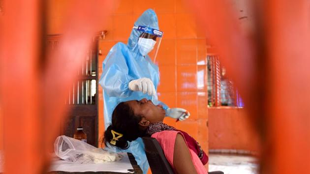 A Brihanmumbai Municipal Corporation (BMC) health worker collects a swab sample from a resident of Mandala Village in Mumbai on July 19. The Covid-19 case fatality rate (CFR) is progressively falling in India and is currently at 2.49%, among the lowest in the world, according to the Health Ministry. (Satish Bate / HT Photo) A Brihanmumbai Municipal Corporation (BMC) health worker collects a swab sample from a resident of Mandala Village in Mumbai on July 19. The Covid-19 case fatality rate (CFR) is progressively falling in India and is currently at 2.49%, among the lowest in the world, according to the Health Ministry. (Satish Bate / HT Photo)