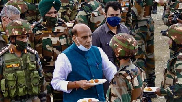 Defence Minister Rajnath Singh exchanges sweets while interacting with Indian Army personnel as he visits the forward posts near Line of Control, in Kashmir on Saturday.(ANI Photo) Defence Minister Rajnath Singh exchanges sweets while interacting with Indian Army personnel as he visits the forward posts near Line of Control, in Kashmir on Saturday.(ANI Photo)