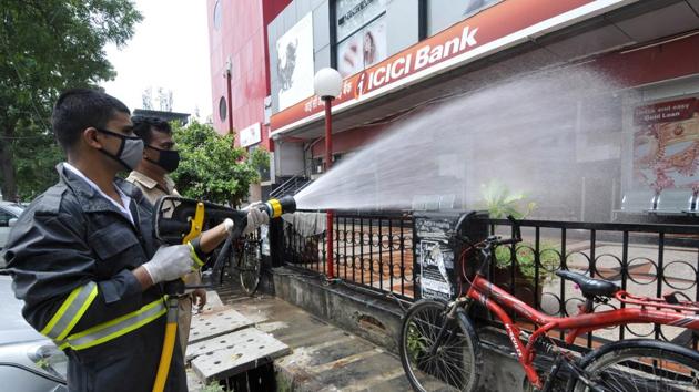 Fire services personnel chemically disinfect a bank premises at Sector 18 in Noida on July 19. From 2.82% over a month earlier, India’s Covid-19 case fatality rate declined to 2.72% on July 10 and has further reduced to 2.49% presently, the Health Ministry statement said. (Sunil Ghosh / HT Photo) Fire services personnel chemically disinfect a bank premises at Sector 18 in Noida on July 19. From 2.82% over a month earlier, India’s Covid-19 case fatality rate declined to 2.72% on July 10 and has further reduced to 2.49% presently, the Health Ministry statement said. (Sunil Ghosh / HT Photo)