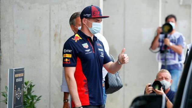 Red Bull's Max Verstappen wears a protective face mask as he arrives at the track ahead of the Hungarian Grand Prix.(REUTERS)