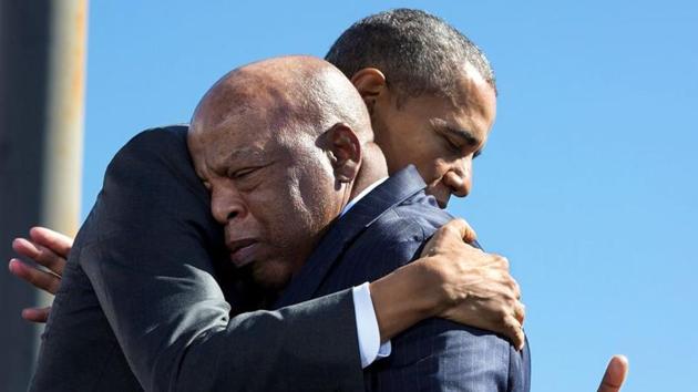 US President Barack Obama hugs Rep. John Lewis, D-Ga. after his introduction during the event to commemorate the 50th Anniversary of Bloody Sunday and the Selma to Montgomery civil rights marches, at the Edmund Pettus Bridge in Selma, Alabama.(via REUTERS)