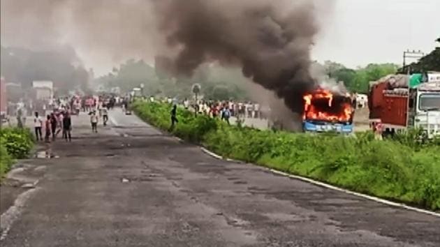 Locals set police vehicles and public buses on fire, block road during a protest against an alleged rape and murder of a girl in Bengal’s north Dinajpur district on Sunday.(ANI)