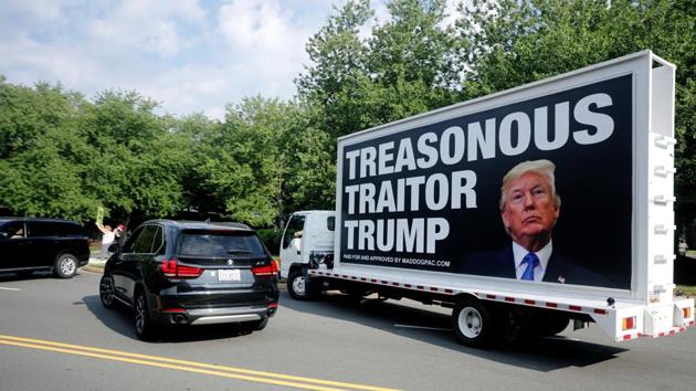 Protesters gather outside as US President Donald Trump arrives to play golf at the Trump National Golf Club in Sterling, Virginia. (REUTERS) Protesters gather outside as US President Donald Trump arrives to play golf at the Trump National Golf Club in Sterling, Virginia. (REUTERS)
