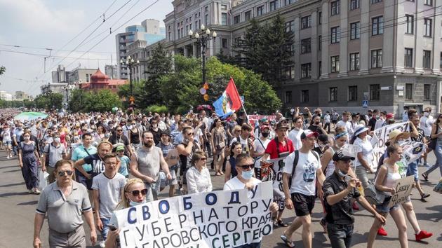 People hold posters that read: "Freedom for Khabarovsk region's governor Sergei Furgal" during an unsanctioned protest in support of Sergei Furgal, the governor of the Khabarovsk region, in Khabarovsk, 6100 kilometers (3800 miles) east of Moscow, Russia. (PTI)