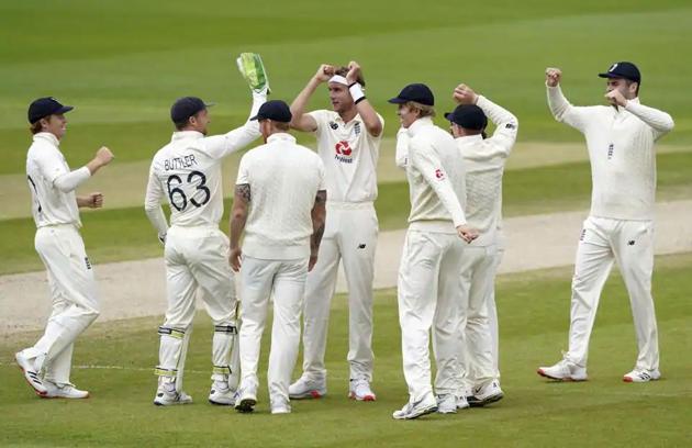 England’s Stuart Broad, center, celebrates with teammates the dismissal of West Indies’ Shai Hope. (AP)