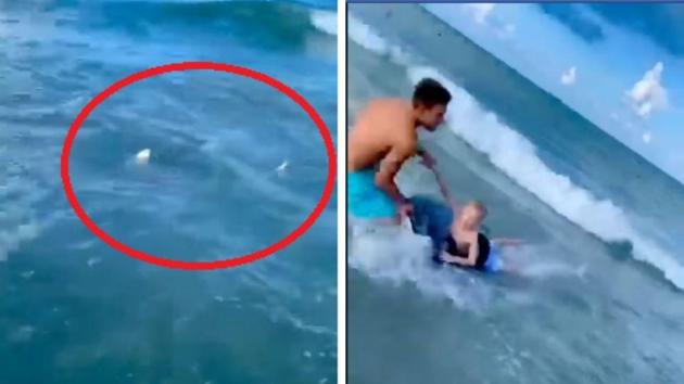 The image shows the cop pulling the boy to safety. (Facebook/Cocoa Beach Police & Fire) The image shows the cop pulling the boy to safety. (Facebook/Cocoa Beach Police & Fire)