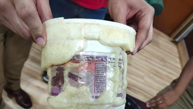 The cash was allegedly sent by a Pakistan LeT commander was hidden in a tiffin box .(HT PHOTO)