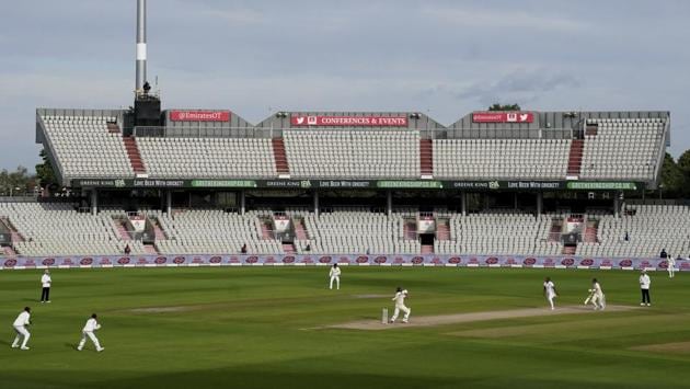 England's Ben Stokes, center, plays a shot during the fourth day of the second cricket Test match between England and West Indies at Old Trafford in Manchester, England, Sunday. (AP)