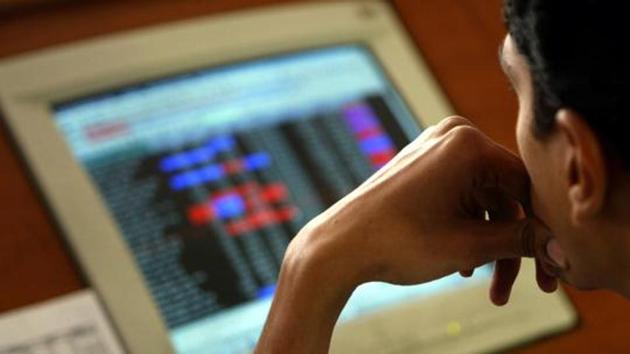 An equity advisor watches share prices at a financial consultants' firm in Mumbai. (AP)