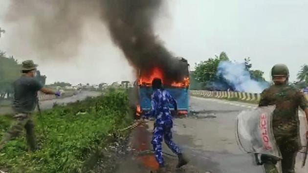 A bus that was set on fire on Sunday in Bengal’s north Dinajpur district during clashes during a protest against an alleged rape and murder of a girl .(ANI)
