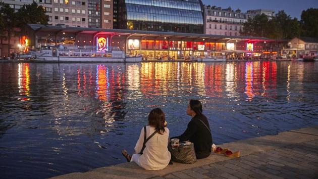 Parisians on the opening night of Paris Plages at La Villette on July 18 in Paris. “I really enjoy open-air cinema. It marks the beginning of the summer, and even if we already are in mid-July, for me it marks the beginning of the Parisian summer adventures,” 25-year-old Eloise Blomme told Reuters. (Kiran Ridley / Getty Images) Parisians on the opening night of Paris Plages at La Villette on July 18 in Paris. “I really enjoy open-air cinema. It marks the beginning of the summer, and even if we already are in mid-July, for me it marks the beginning of the Parisian summer adventures,” 25-year-old Eloise Blomme told Reuters. (Kiran Ridley / Getty Images)