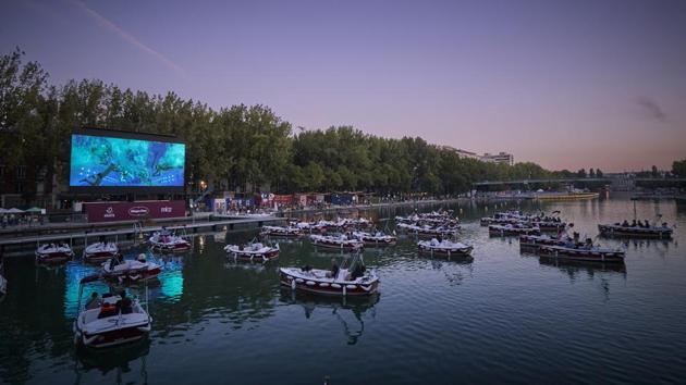 Parisians during a screening at the floating cinema at La Villette, on July 18. Reuters reported that people heading to the opening of Paris Plages were met with Covid-19 testing centres using PCR (polymerase chain reaction) tests with a capacity to carry out 150 to 200 a day. (Kiran Ridley / Getty Images) Parisians during a screening at the floating cinema at La Villette, on July 18. Reuters reported that people heading to the opening of Paris Plages were met with Covid-19 testing centres using PCR (polymerase chain reaction) tests with a capacity to carry out 150 to 200 a day. (Kiran Ridley / Getty Images)