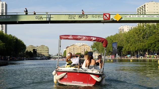 A general view during the "Le Cinema Sur L'Eau" event organized by Paris Plages on July 18 in Paris. According to Reuters, the artificial beaches on the banks of the Seine in central Paris and the Bassin de la Villette, a man-made lake in the northeast of the city, have been a roaring success since they were launched by Paris Mayor Bertrand Delanoe in 2002. (Pascal Le Segretain / Getty Images) A general view during the "Le Cinema Sur L'Eau" event organized by Paris Plages on July 18 in Paris. According to Reuters, the artificial beaches on the banks of the Seine in central Paris and the Bassin de la Villette, a man-made lake in the northeast of the city, have been a roaring success since they were launched by Paris Mayor Bertrand Delanoe in 2002. (Pascal Le Segretain / Getty Images)