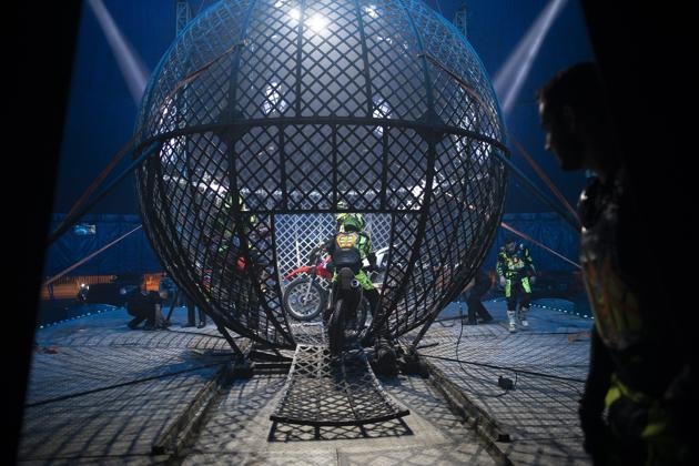 Artists enter the Globe of death on motorcycles at the Estoril Circus despite the coronavirus pandemic in Itaguai, greater Rio de Janeiro, Brazil, Saturday, July 18, 2020. (AP)