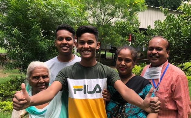 Gagan Kumar, a humanities student of RS Sr Sec school,scored 99.33% with his father Rajinder Kumar and mother Manju Rani in Ludhiana on Tuesday. (HT Photo) Gagan Kumar, a humanities student of RS Sr Sec school,scored 99.33% with his father Rajinder Kumar and mother Manju Rani in Ludhiana on Tuesday. (HT Photo)