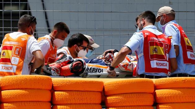 Repsol Honda’s Marc Marquez is stretchered into an ambulance after crashing out during the race. (Reuters) Repsol Honda’s Marc Marquez is stretchered into an ambulance after crashing out during the race. (Reuters)