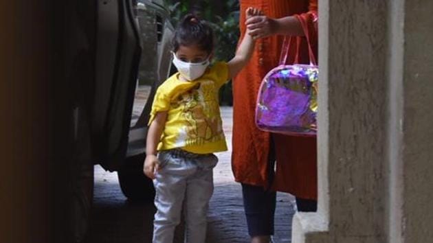Inaaya, daughter of actors Kunal Kemmu and Soha Ali Khan, looked like a ray of sunshine in a yellow top. She wore a white face mask. (Varinder Chawla)