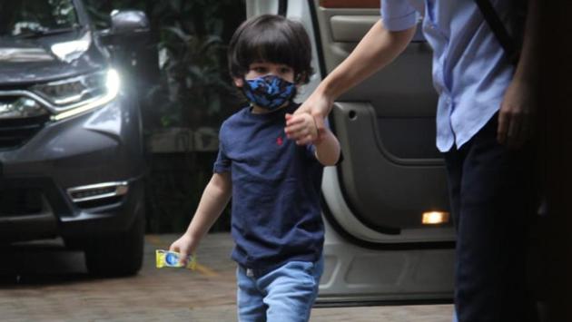 Taimur, son of actors Saif Ali Khan and Kareena Kapoor Khan, wore a navy blue tee and jeans. He had a matching blue face mask on. (Varinder Chawla)