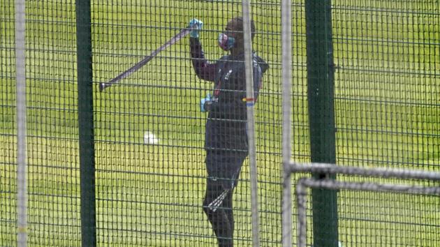England's Jofra Archer wearing face mask and gloves as a precaution against the coronavirus trains in the nets at Old Trafford in Manchester(AP)