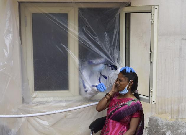 A health worker collects a swab sample from a woman for a coronavirus test in New Delhi on July 20. According to the data released by the Indian Council of Medical Research (ICMR) 1.43 crore samples have been tested for coronavirus in India as of July 20. India’s Covid-19 testing per million has now crossed the 10,000-mark. (Vipin Kumar / HT Photo) A health worker collects a swab sample from a woman for a coronavirus test in New Delhi on July 20. According to the data released by the Indian Council of Medical Research (ICMR) 1.43 crore samples have been tested for coronavirus in India as of July 20. India’s Covid-19 testing per million has now crossed the 10,000-mark. (Vipin Kumar / HT Photo)