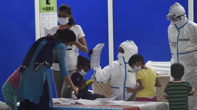 Doctors engage with children inside the Common Wealth Games Village Sports Complex (CWG) COVID-19 Care Centre in New Delhi on July 20. Despite surging coronavirus cases, India’s COVID-19 case fatality rate is ‘progressively falling’ and is currently at 2.49%, which is one of the lowest in the world, the Union Health Ministry said in a statement. (Ajay Aggarwal / HT Photo) Doctors engage with children inside the Common Wealth Games Village Sports Complex (CWG) COVID-19 Care Centre in New Delhi on July 20. Despite surging coronavirus cases, India’s COVID-19 case fatality rate is ‘progressively falling’ and is currently at 2.49%, which is one of the lowest in the world, the Union Health Ministry said in a statement. (Ajay Aggarwal / HT Photo)