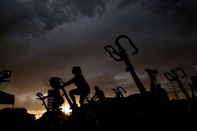 People exercise at the parking lot of a gym, where its fitness equipment was temporarily moved, as the government has not announced a reopening date for fitness centers, during the coronavirus disease (COVID-19) outbreak, in Ciudad Juarez, Mexico July 15, 2020. (Representational)(via REUTERS) People exercise at the parking lot of a gym, where its fitness equipment was temporarily moved, as the government has not announced a reopening date for fitness centers, during the coronavirus disease (COVID-19) outbreak, in Ciudad Juarez, Mexico July 15, 2020. (Representational)(via REUTERS)