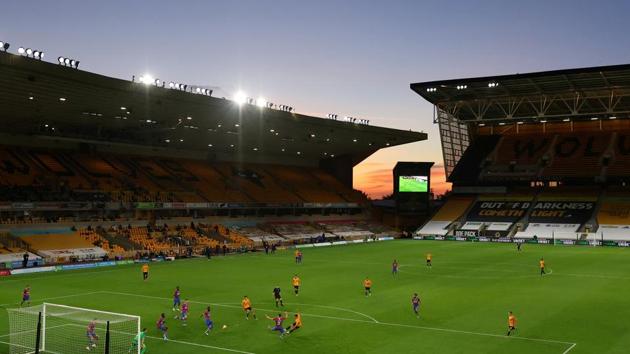 Soccer Football - Premier League - Wolverhampton Wanderers v Crystal Palace - Molineux Stadium, Wolverhampton, Britain - July 20, 2020 General view as Wolverhampton Wanderers' Jonny scores their second goal, as play resumes behind closed doors following the outbreak of the coronavirus disease (COVID-19) Pool via REUTERS/Richard Heathcote EDITORIAL USE ONLY. No use with unauthorized audio, video, data, fixture lists, club/league logos or 'live' services. Online in-match use limited to 75 images, no video emulation. No use in betting, games or single club/league/player publications. Please contact your account representative for further details. TPX IMAGES OF THE DAY(Pool via REUTERS)