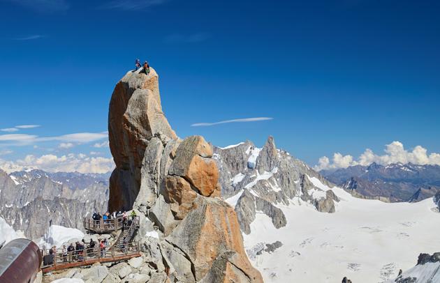 Tourists and alpinists visit the Aiguille du Midi near the Mont-Blanc in Chamonix, France, July 20, 2020. (REUTERS)