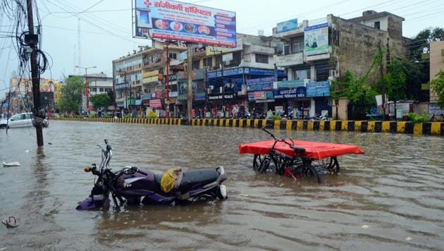 Vehicles are seen submerged on a waterlogged road after heavy rain in Haridwar on Tuesday.(ANI Photo)