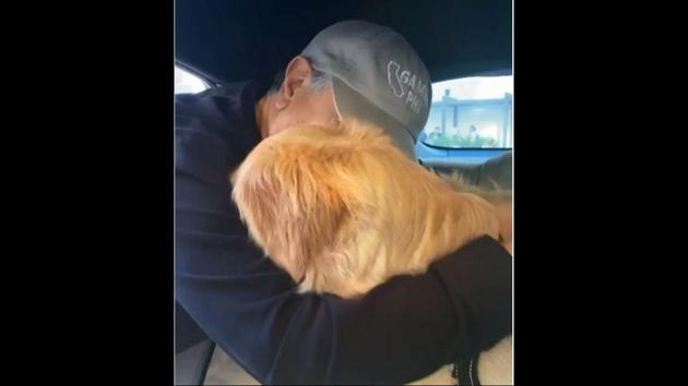 The image shows the dog hugging its grandpa. (Instagram/@bumblebeethegolden) The image shows the dog hugging its grandpa. (Instagram/@bumblebeethegolden)