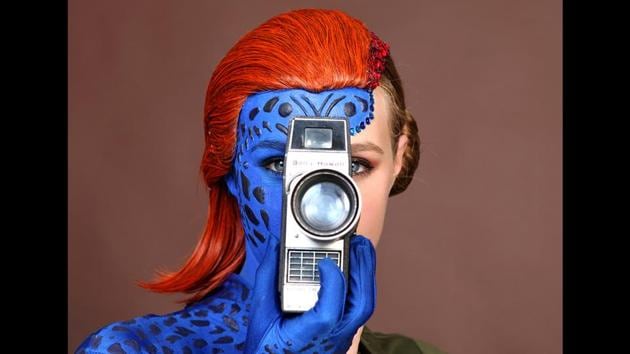 Evy Thomas, dressed as Mystique, on day one of Comic-Con International in San Diego on July 18, 2019. (Cabage/Invision/AP)