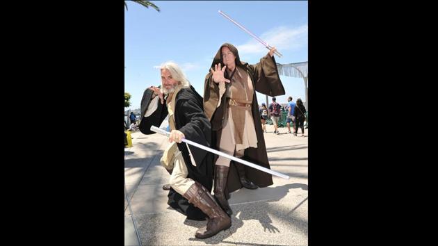 Paul Primose (L) and Joyce Primose dressed as Star Wars characters, on day one of Comic-Con International in San Diego on July 18, 2019. (Richard Shotwell/Invision/AP)