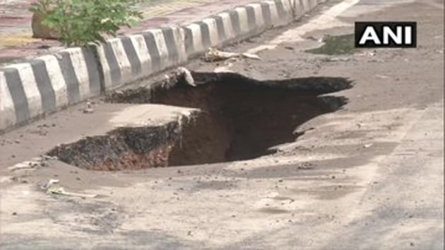 Part of Delhi’s Mahipalpur Bypass caved in following heavy rainfall in the national capital region on Wednesday.(ANIT)